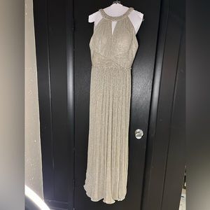 This dress is more champagne. A true mix of silver with flecks of gold shimmer.